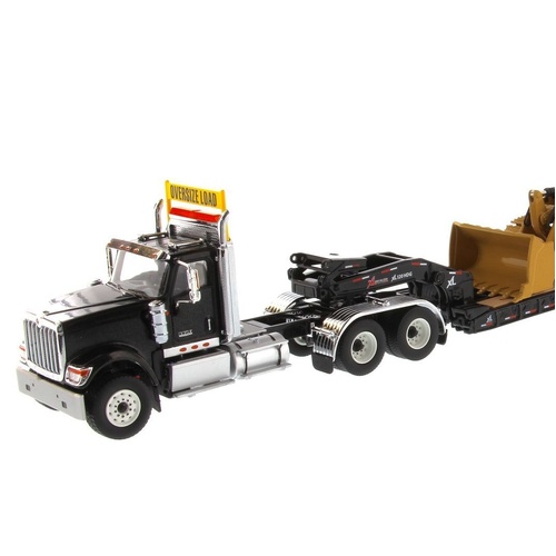 Diecast Masters - 1/50 International HX520 Tandem Tractor + XL 120 Trailer, Black w/ Cat 963K Track loader loaded including both rear boosters