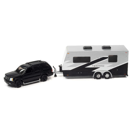 Johnny Lightning - 1/64 2005 Cadillac Escalade in Matte Black with Camper Trailer